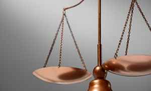 Close-up of a balanced copper scale symbolizing financial justice and wealth management.