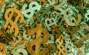 Golden dollar signs and currency symbols for financial success.